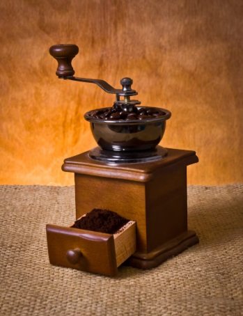A beautifully crafted cappuccino with latte art served on a marble table.